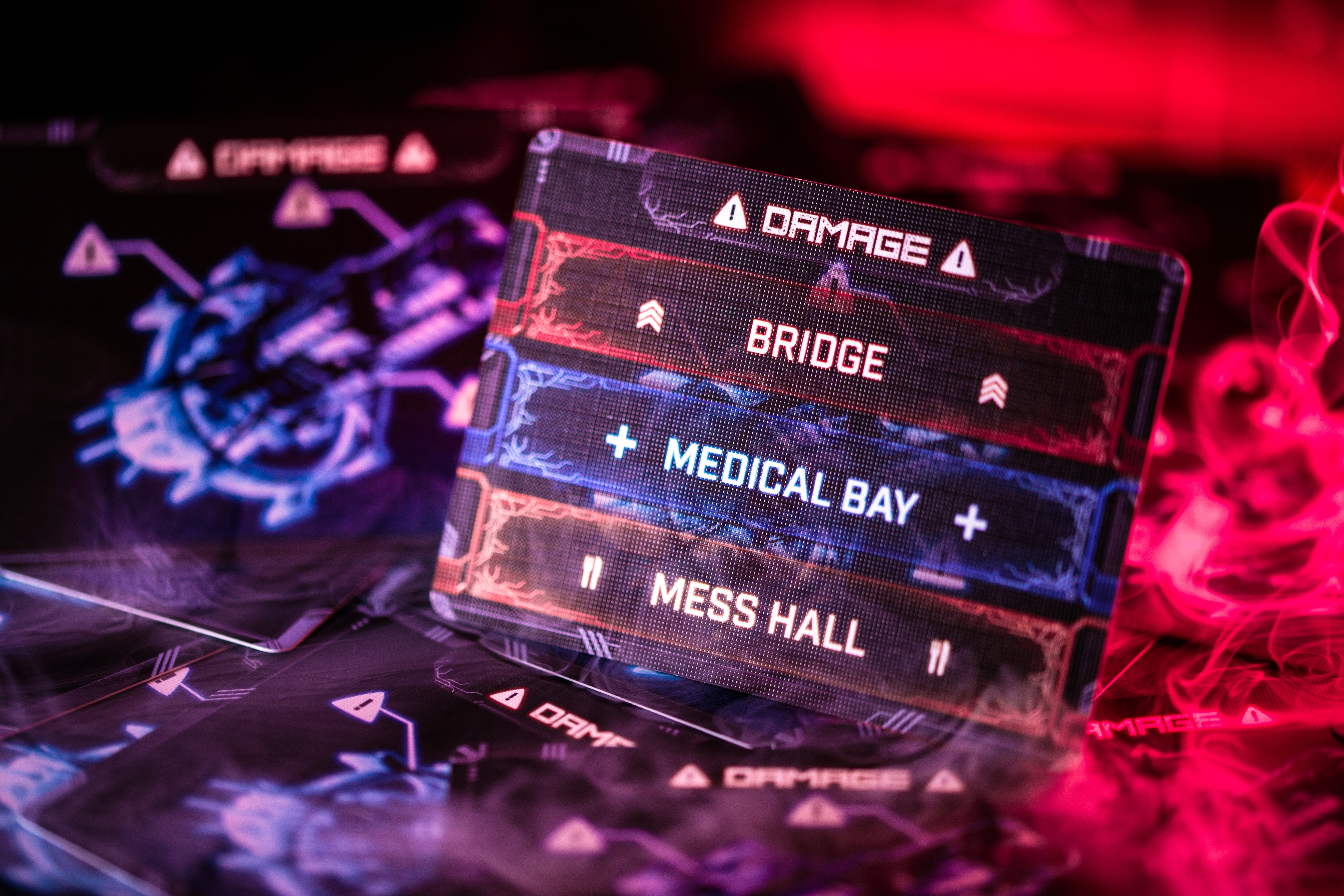 A Builder card from Explorers of Navoria showing a settlement. Photographed with action tokens around it and the game board underneath it.